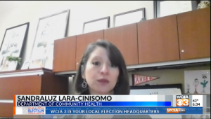 Dr. Lara-Cinisomo giving a tv interview in her office